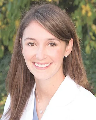 Headshot of Dr. Arielle Scherz wearing a white doctor coat